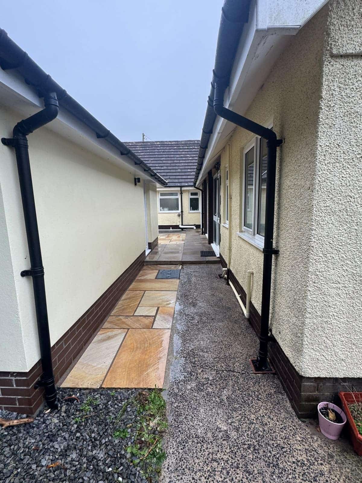 The same side path after pressure washing, the slabs clean