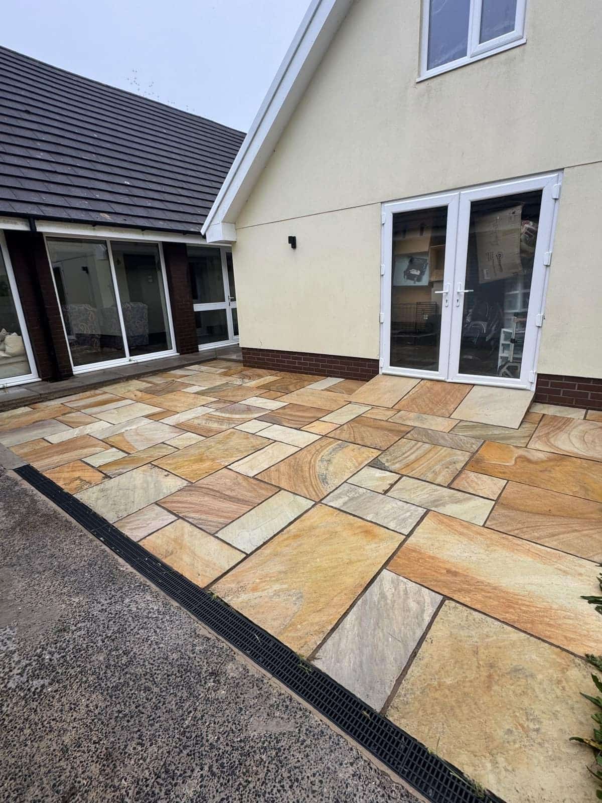 The same patio after pressure washing, clean and bright